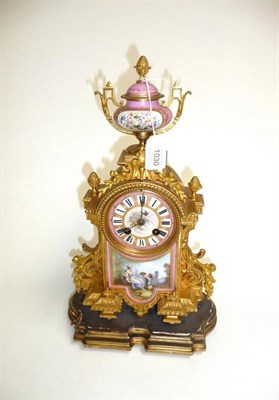 Lot 1030 - A French Gilt Metal and Porcelain Mounted Striking Mantel Clock, circa 1880, pink porcelain urn...