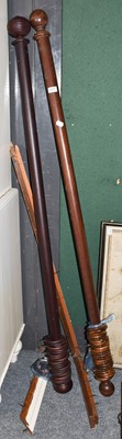 Lot 1207 - Two mahogany curtain poles and rings