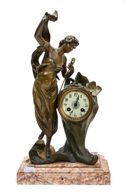 Lot 40 - A spelter and marble figural mantle clock...