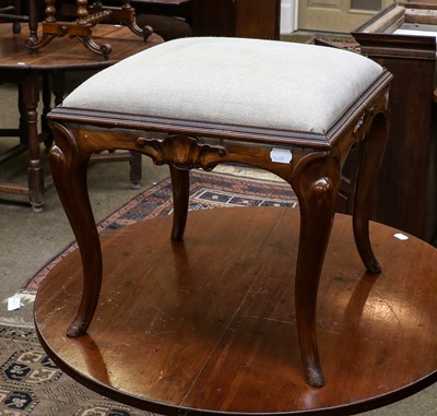 Lot 1347 - A late 19th century walnut low stool with...