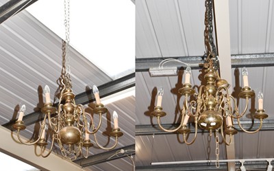 Lot 1449 - A pair of Dutch style six brass chandeliers