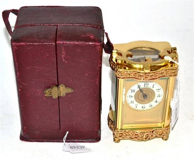 Lot 50 - A cased brass carriage timepiece with key