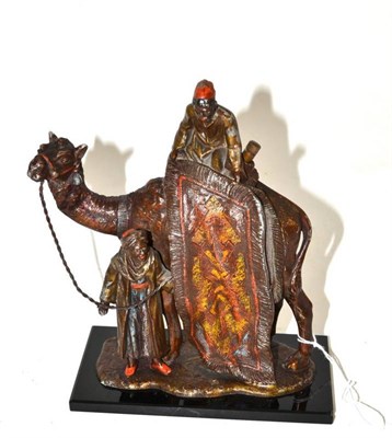 Lot 53 - Cold painted spelter figural lighter of a camel and two figures