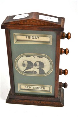 Lot 59 - An Edwardian mahogany desk calendar