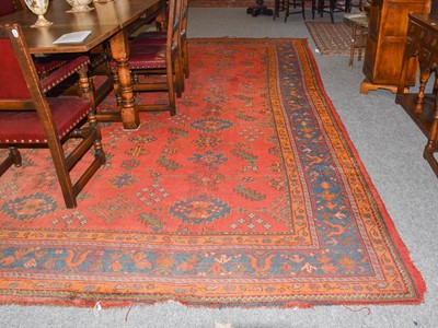 Lot 1111 - Ushak carpet, the tomato red field with...