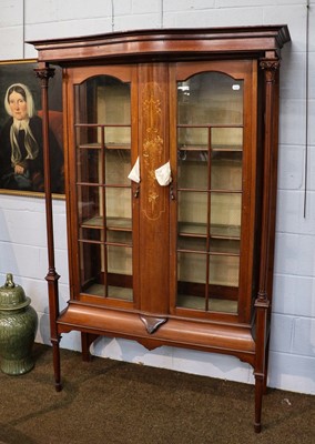 Lot 1316 - An Edwardian inlaid mahogany display cabinet,...