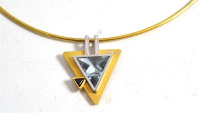 Lot 62 - A contemporary necklace; a yellow pipe collar hung with a triangular pendant inset with a trilliant