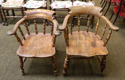 Lot 1378 - Two 19th century elm captain's chairs