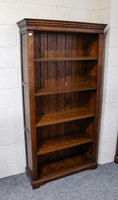 Lot 1242 - A pair of modern oak bookcases with adjustable...