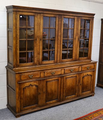 Lot 1243 - A large 20th century glazed oak...