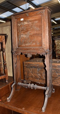 Lot 1429 - A carved oak hall bureau circa 1890, the fall...