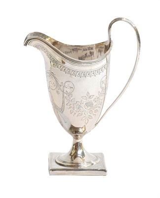 Lot 16 - A George III silver cream jug, by Peter and...