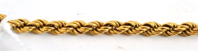 Lot 75 - A rope twist bracelet stamped '750'