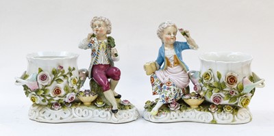 Lot 56 - A pair of German porcelain figural cache pots,...