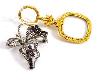 Lot 86 - A magnifier and a garnet and marcasite brooch