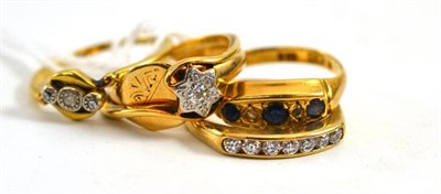 Lot 91 - Five assorted rings including a diamond three stone twist ring, a star shaped diamond set ring,...