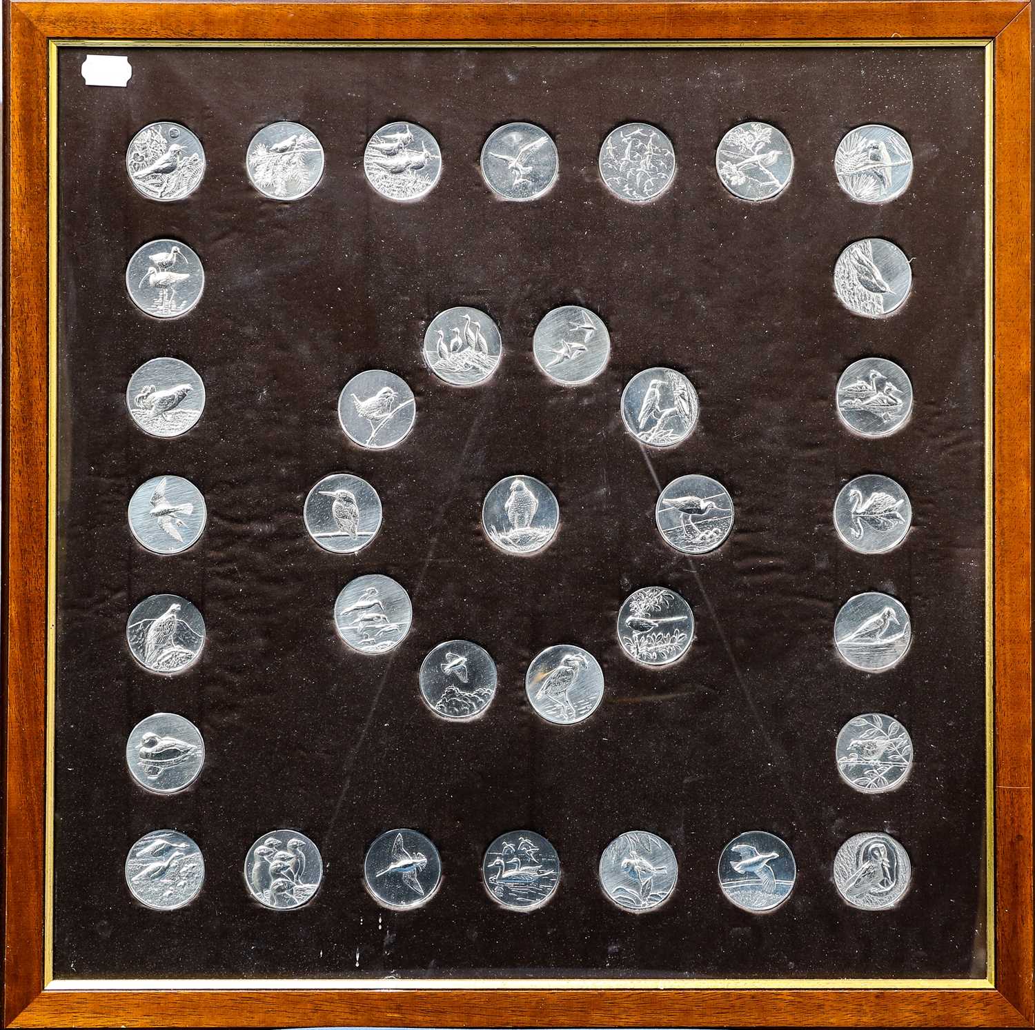 Lot 450 - A Framed Set of Thirty-Five Silver Medallions,...