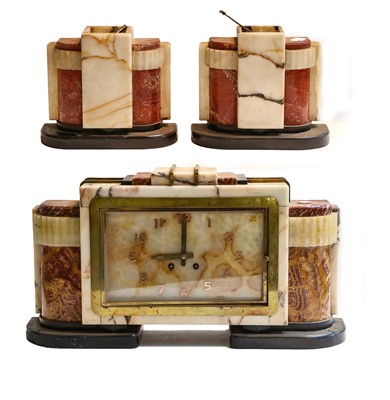 Lot 141 - An Art Deco marble and onyx striking mantel...