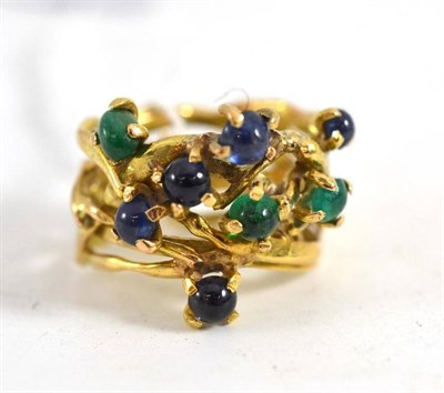 Lot 109 - A contemporary dress ring the entwined mulit-ring design inset with five cabochon sapphires and...