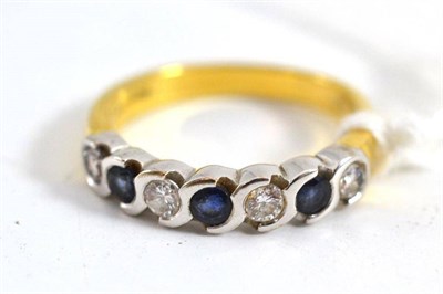 Lot 113 - An 18ct gold sapphire and diamond seven stone ring three round cut sapphires alternate with...