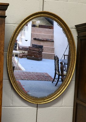 Lot 1244 - Two similar oval gilt framed wall mirrors,...