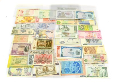 Lot 2298 - A Collection of 100+ Foreign Banknotes,...
