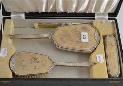 Lot 125 - A cased silver mounted dressing set