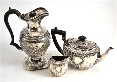 Lot 126 - A late Victorian silver morning tea pot and cream jug, Sheffield 1900 and a hot water jug,...
