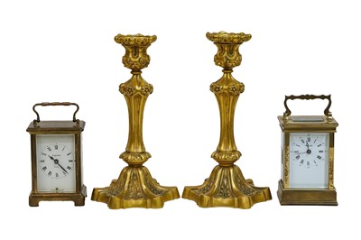 Lot 300 - A pair of gilt bronze candlesticks with...