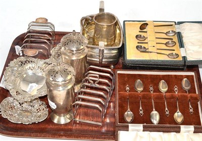 Lot 134 - A quantity of silver including a two toast racks, sucrier, small mug, a pair of coasters, three...