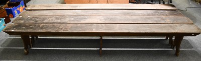 Lot 1237 - Four early 20th-century pine school benches,...