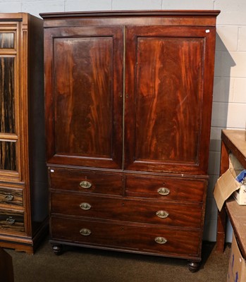 Lot 1433 - A George III mahogany press cupboard, the...