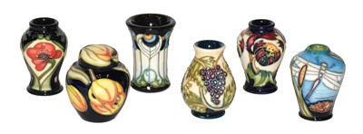 Lot 266 - A set of six modern Moorcroft miniature vases...