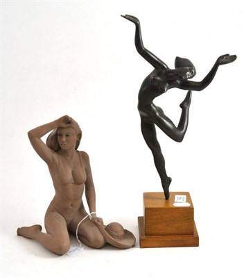 Lot 142 - An Art Deco patinated spelter nude figure, modelled as a dancer, on a stepped oak base, 43cm; and a