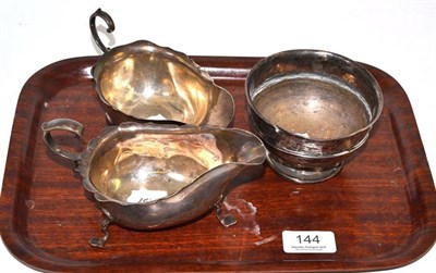 Lot 144 - An Asprey silver sauceboat, another and a boxing trophy (3)
