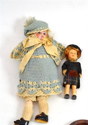 Lot 147 - Bisque socket head doll with blonde wig, fixed blue eyes, in later knitted outfit and a...
