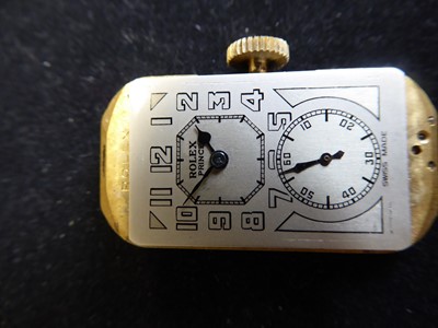 Lot 2107 - Rolex: A Rare 9 Carat White and Yellow Gold Flared Sided Rectangular Wristwatch