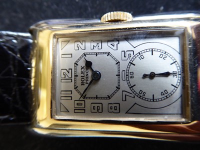Lot 2107 - Rolex: A Rare 9 Carat White and Yellow Gold Flared Sided Rectangular Wristwatch