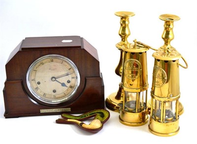 Lot 155 - Two Eccles brass miner's lamps, pair of brass candlesticks, mantel clock and cased pipe
