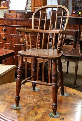 Lot 1356 - An Elm child's Windsor high chair