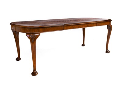 Lot 1373 - A 20th century burr walnut nine-piece dining...