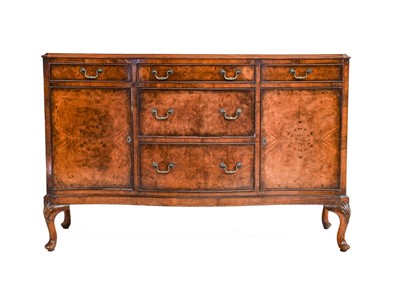 Lot 1373 - A 20th century burr walnut nine-piece dining...