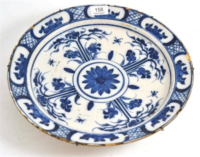 Lot 158 - Late 18th century blue and white tin glaze plate decorated with flowers