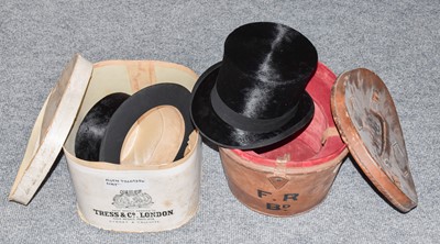 Lot 1091 - Black silk top hat in a brown leather case,...