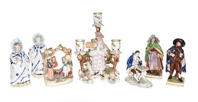 Lot 310 - A Sitzendorf figural three branch candelabra,...