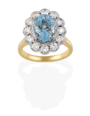 Lot 2426 - An 18 Carat Gold Aquamarine and Diamond Cluster Ring