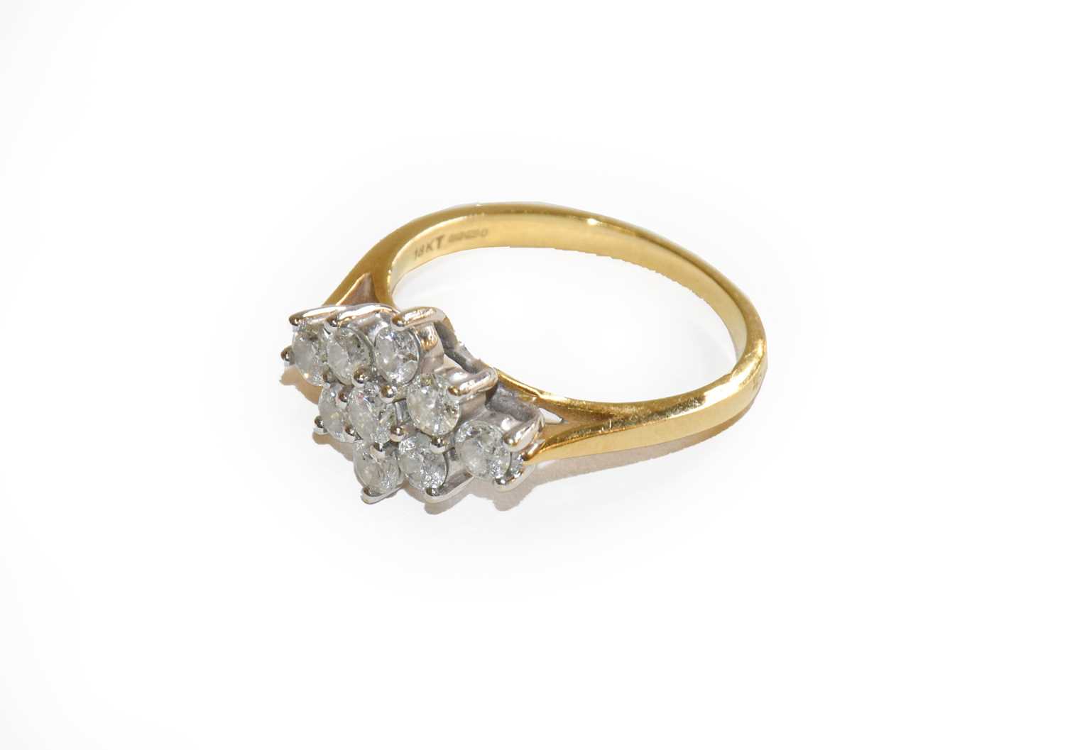 Lot 195 - An 18 carat gold diamond cluster ring, finger...