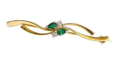 Lot 193 - An 18 carat gold emerald and diamond bar...