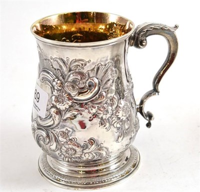 Lot 169 - A George III silver baluster mug with later foliate chased and repousse decoration, London 1767