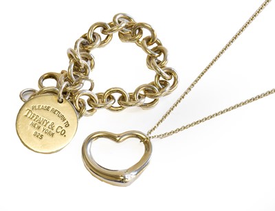Lot 171 - A silver Tiffany & Co heart-shaped pendant on...